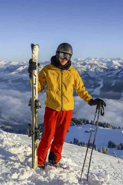 Framed Print : Skier standing at the ski slope holding ski