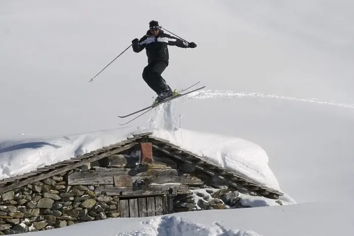 Framed Print : Skiers jumping on the Wildkogel