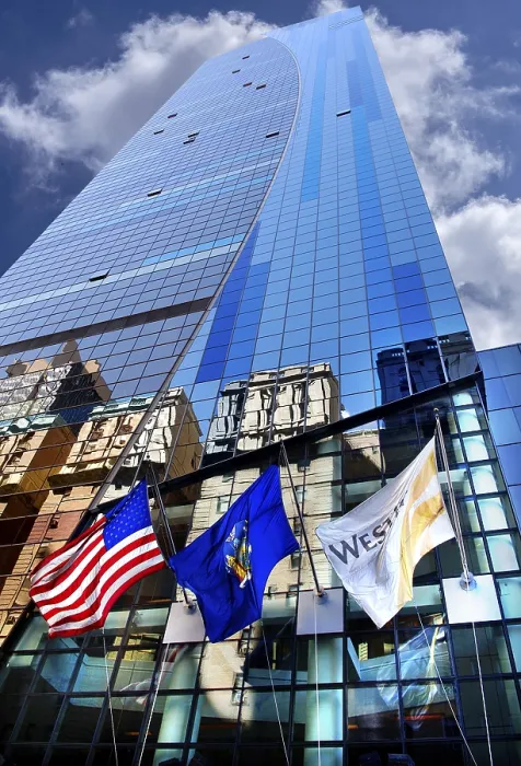 Framed Print : Skyscraper facade with flags and reflection in the glass facade