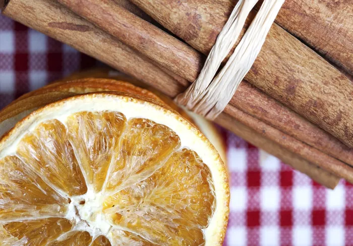 Framed Print : Slices of dried orange and cinnamon sticks on a chequered cloth Framed Print : Slices of dried orange and cinnamon sticks on a chequered cloth