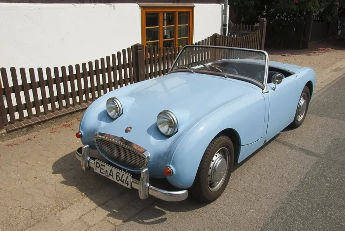 Framed Print : Small blue Austin Healey convertible classic car parked in urban environment Framed Print : Small blue Austin Healey convertible classic car parked in urban environment