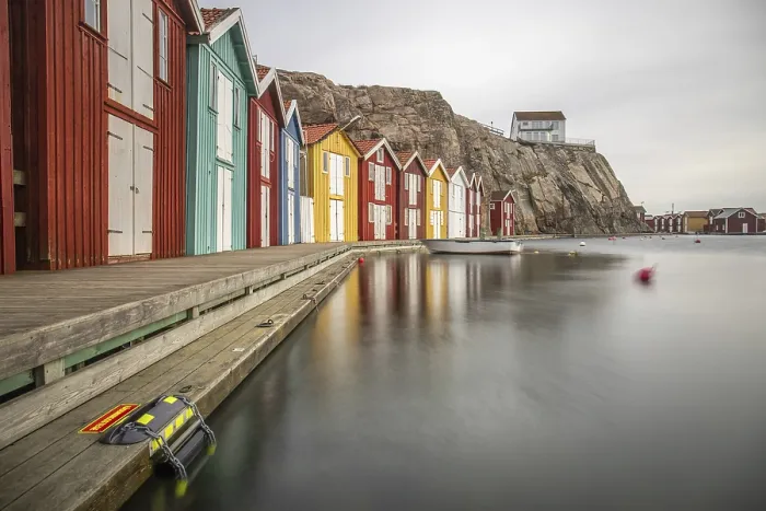 Framed Print : Small colourful houses by the sea