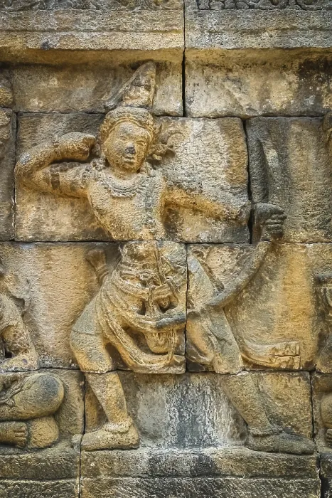 Framed Print : Small figure of a female archer carved on the wall in the Borobudur temple in Java Framed Print : Small figure of a female archer carved on the wall in the Borobudur temple in Java