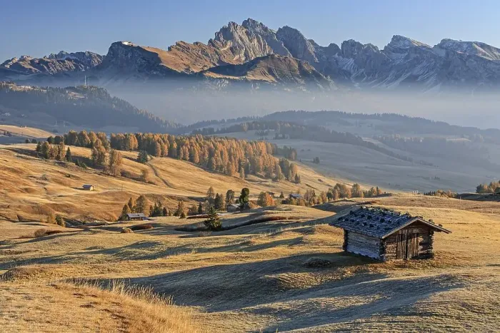 Framed Print : Small hut on alp in front of mountains in the morning light