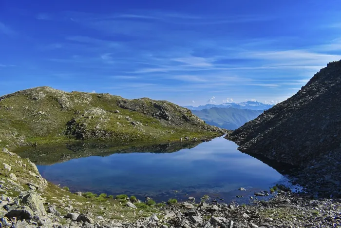 Framed Print : Small mountain lake below the Weisse Spitze with a view of the Grossglockner on the horizon