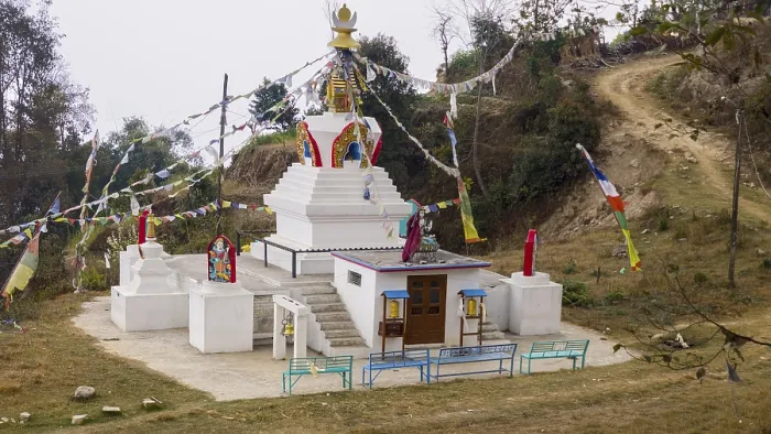 Framed Print : Small stupa with colorful prayer flags on a hill