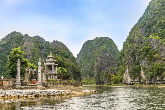Framed Print : Small temple with forested limestone rocks Framed Print : Small temple with forested limestone rocks