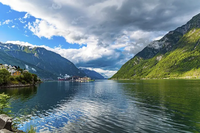 Framed Print : Small town of Odda. Magical late summer sunset illuminates the city and the water Framed Print : Small town of Odda. Magical late summer sunset illuminates the city and the water