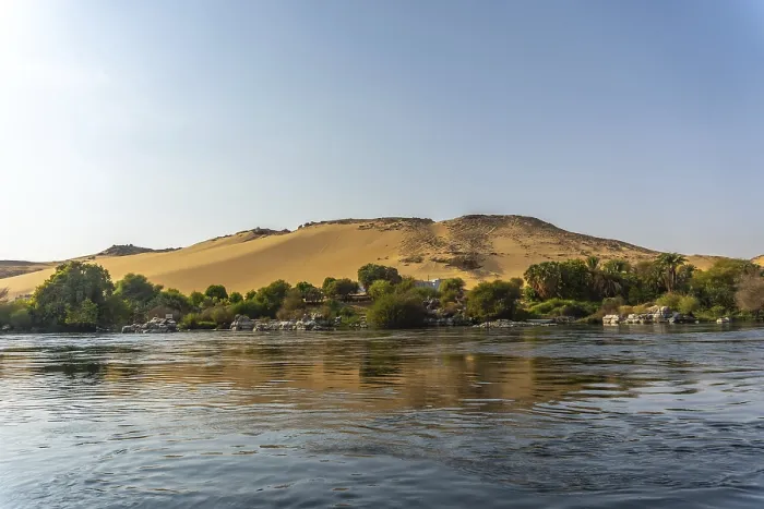 Framed Print : Small towns and ancient temples navigating the Nile River in Aswan city Framed Print : Small towns and ancient temples navigating the Nile River in Aswan city
