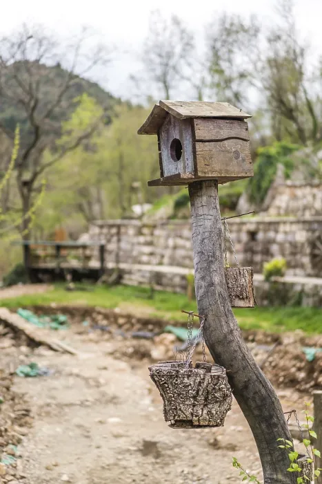 Framed Print : Small wooden bird feeder on a farm in Montenegro
