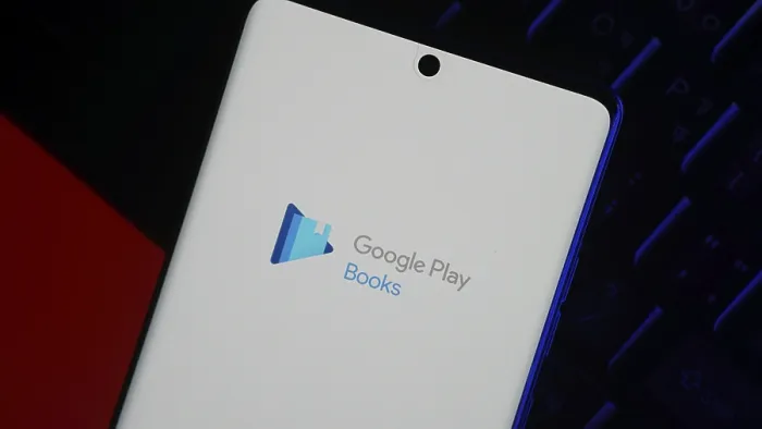 Framed Print : Smartphone displaying Google Play Books app logo on screen against a dark background