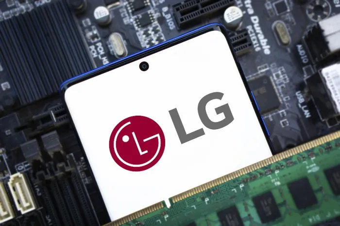 Framed Print : Smartphone with LG Electronics logo on the screen