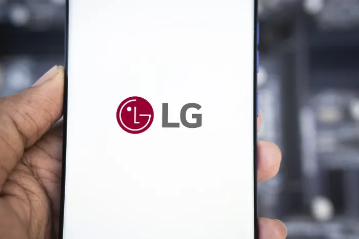 Framed Print : Smartphone with LG Electronics logo on the screen