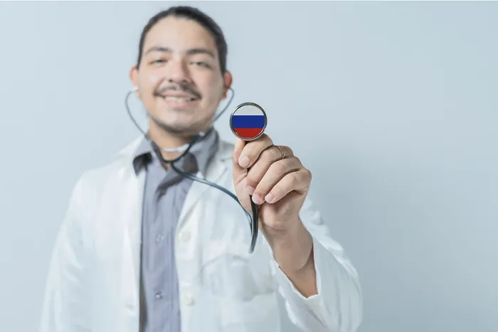 Framed Print : Smiling doctor showing stethoscope with Russia flag