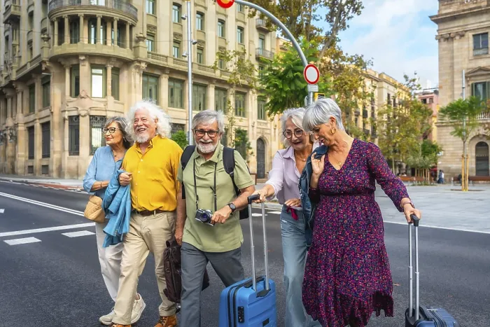 Framed Print : Smiling group of senior friends exploring a european city on vacation