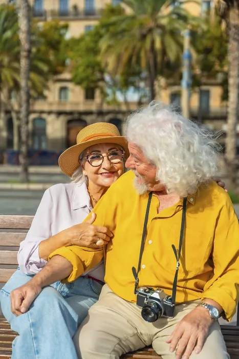 Framed Print : Smiling senior woman embracing her husband on a bench