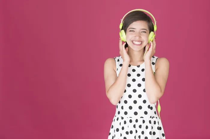 Framed Print : Smiling woman listening to music on headphones Framed Print : Smiling woman listening to music on headphones