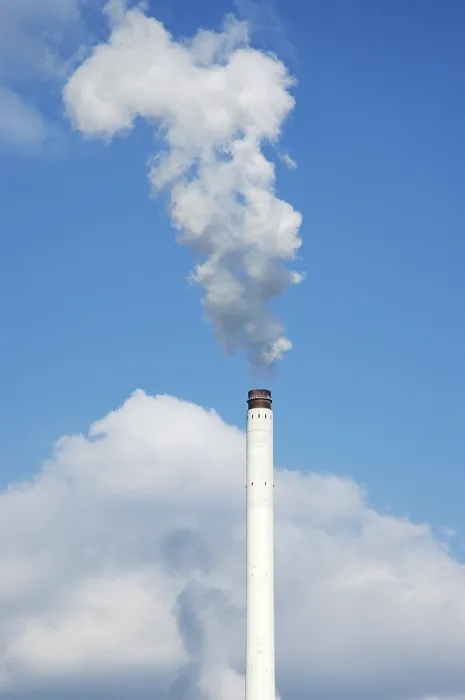 Framed Print : Smoking chimney in front of a blue sky