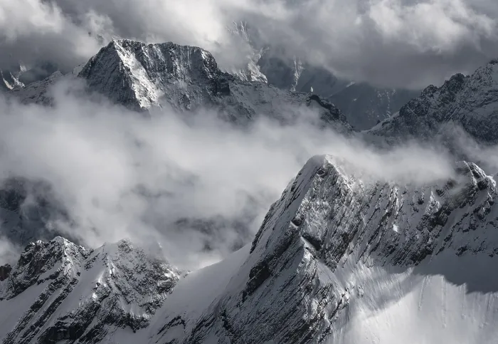 Framed Print : Snow-capped mountains and clouds create a dramatic atmosphere Framed Print : Snow-capped mountains and clouds create a dramatic atmosphere
