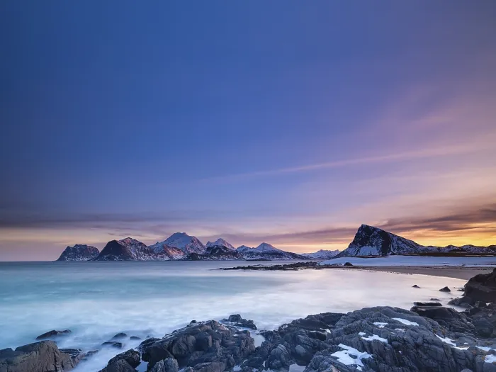 Framed Print : Snow-capped mountains by the sea