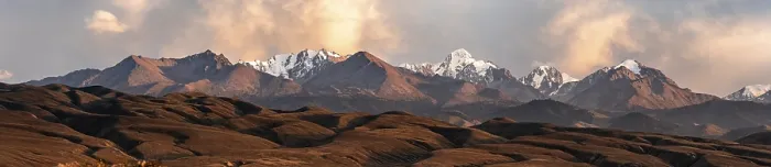Framed Print : Snow-covered and glaciated mountain peaks at sunset Framed Print : Snow-covered and glaciated mountain peaks at sunset