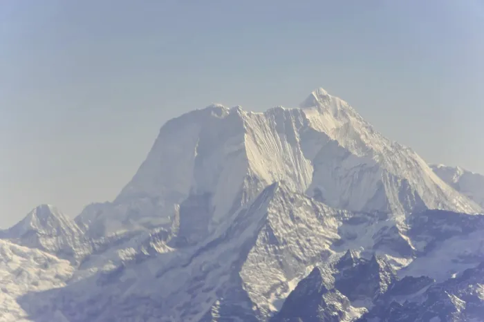 Framed Print : Snow-covered mountain peaks under a clear sky