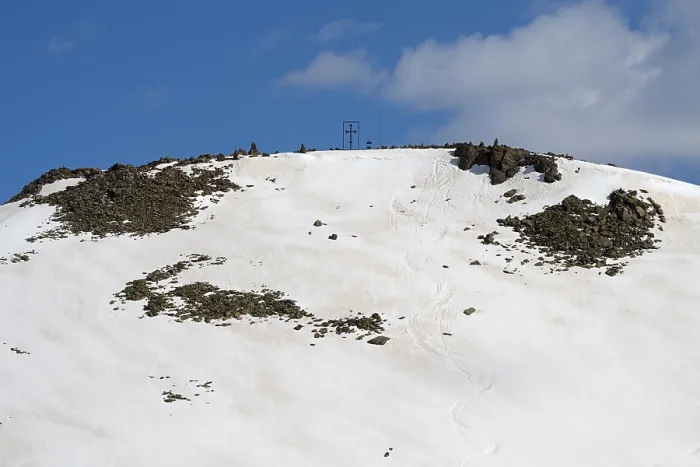 Framed Print : Snow-covered mountain top with rocks