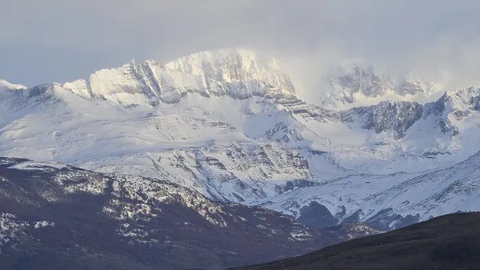 Framed Print : Snow-covered mountains under a cloudy sky Framed Print : Snow-covered mountains under a cloudy sky