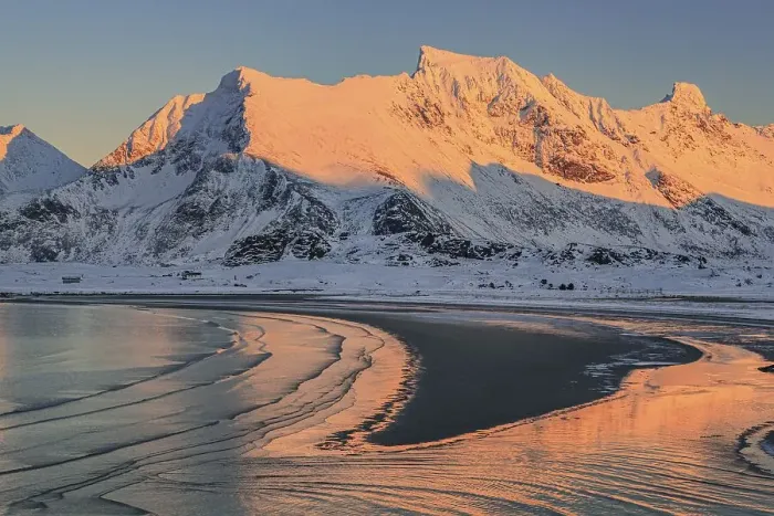 Framed Print : Snow-covered mountains in the evening light on the coast Framed Print : Snow-covered mountains in the evening light on the coast