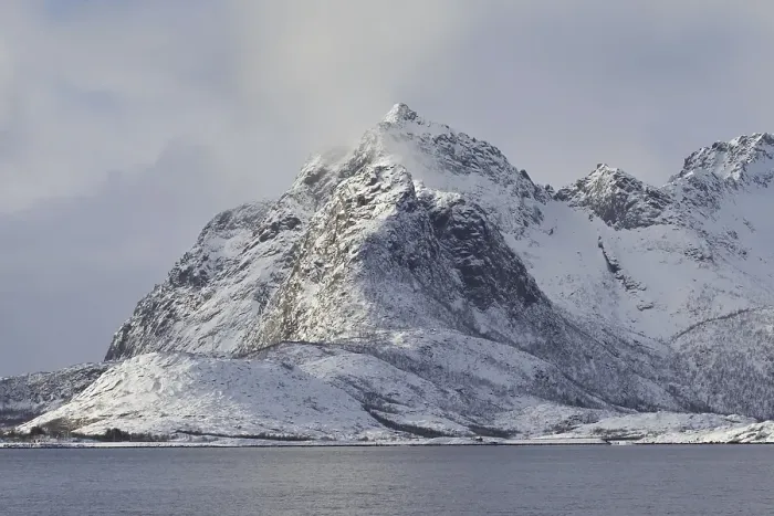 Framed Print : Snow covered mountains along the fjord Raftsund in winter