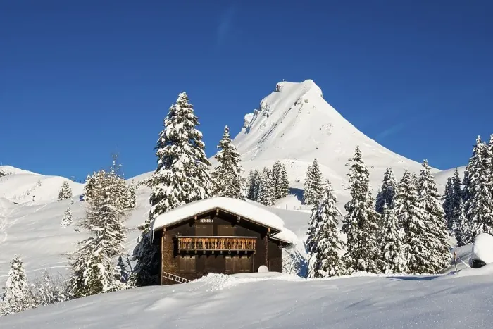 Framed Print : Snow-covered mountains and mountain hut with ski slope