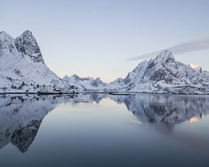 Framed Print : Snow-covered mountains reflected in fjord