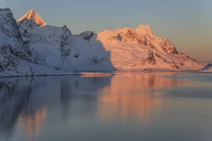 Framed Print : Snow-covered mountains reflected in the fjord at sunrise Framed Print : Snow-covered mountains reflected in the fjord at sunrise