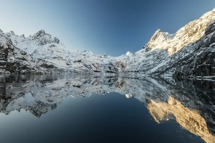 Framed Print : Snow covered mountains reflecting in the Trollfjord