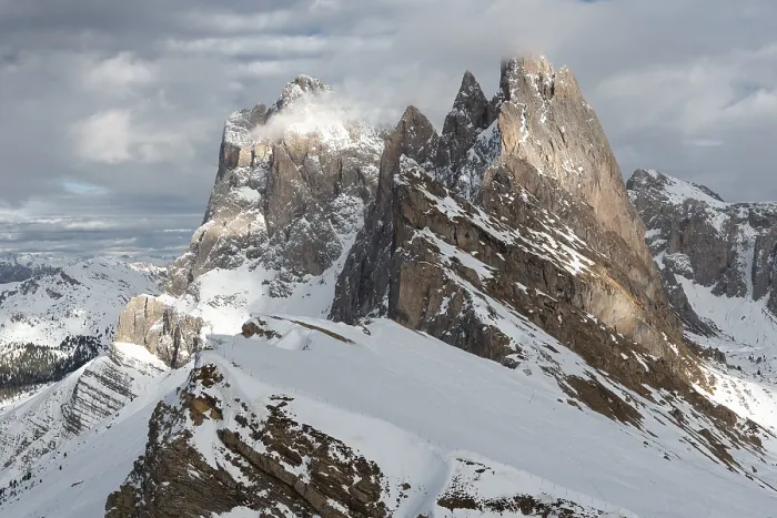 Framed Print : Snow-covered mountains rose majestically in the cloudy sky