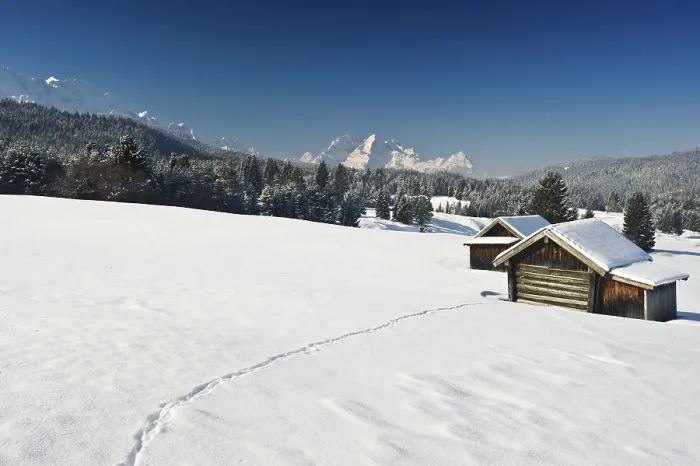 Framed Print : Snow-covered pastures and hay barns