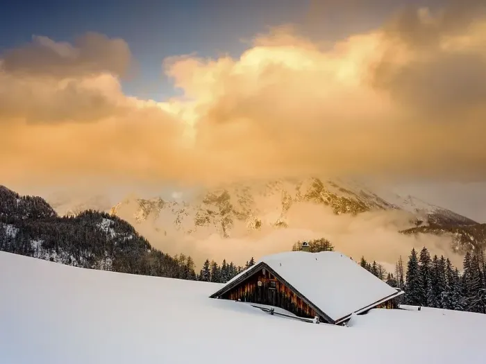 Framed Print : Snow-covered Priesbergalm in front of cloud-covered Watzmann