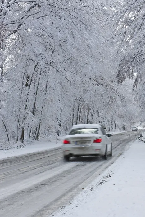 Framed Print : Snow-covered road in winter with traffic