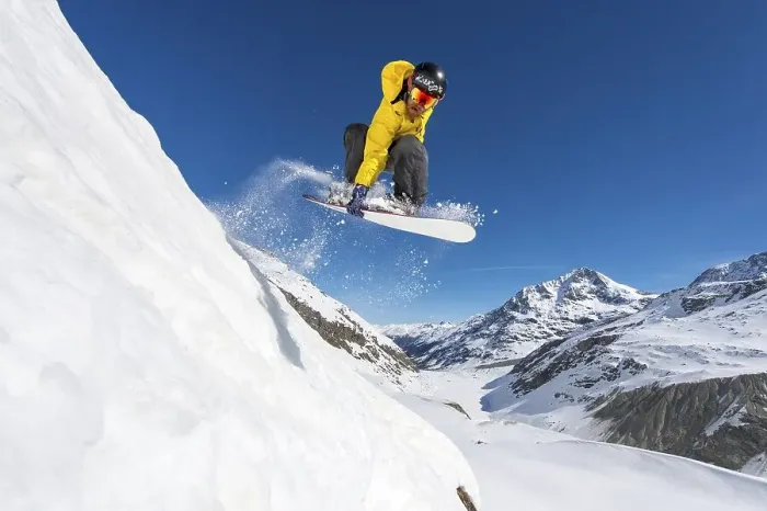 Framed Print : Snowboarder jumping in deep snow