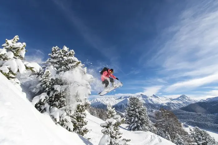Framed Print : Snowboarder jumping over trees, St