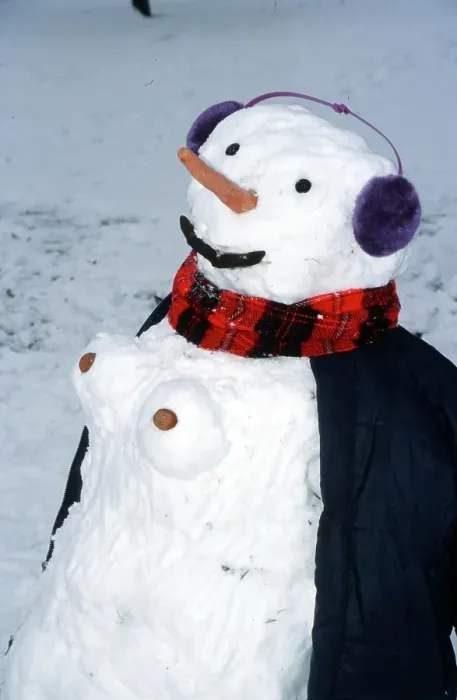 Framed Print : Snowwoman, snowman with ear protectors