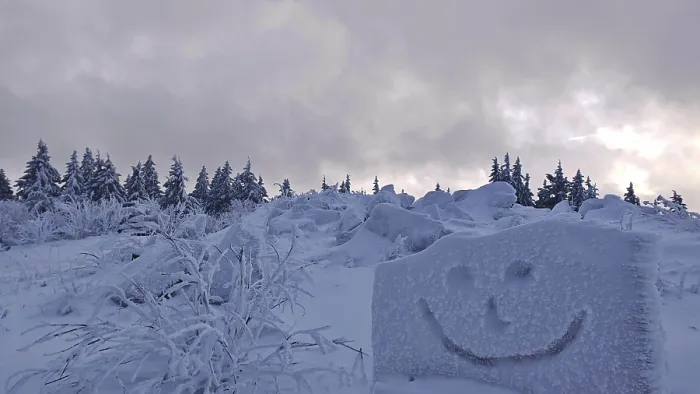 Framed Print : Snowy forest with a smiley face drawn in snow under a cloudy sky Framed Print : Snowy forest with a smiley face drawn in snow under a cloudy sky