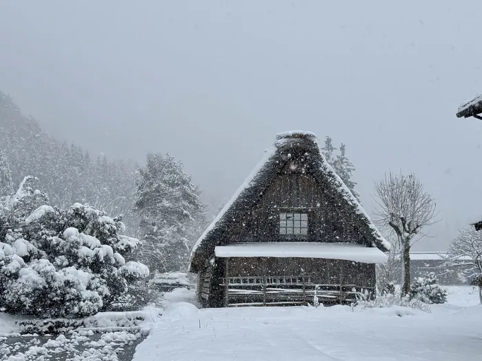 Framed Print : Snowy hut with gable roof surrounded by trees and snow