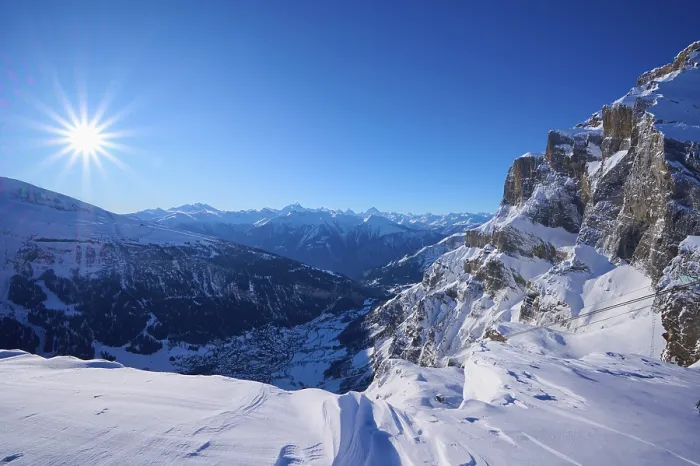 Framed Print : Snowy mountain landscape under a clear blue sky with bright sunshine