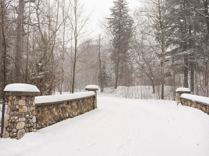 Framed Print : A snowy path through a serene forest with a stone bridge in London