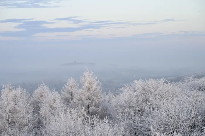 Framed Print : Snowy range of hills with frosty trees in the morning light