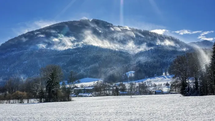 Framed Print : Snowy winter landscape with mountains in the background and sunny sky