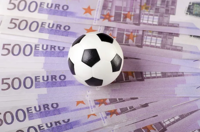 Framed Print : Soccer ball on background of euro banknotes