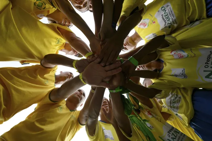 Framed Print : Soccer team motivating themselves in a circle before a game Framed Print : Soccer team motivating themselves in a circle before a game