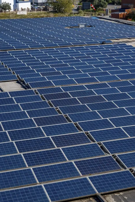 Framed Print : Solar panels are covering an industrial building rooftop
